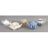 A collection of ceramic teapots and jugs, including Royal Doulton Geneva, Dudson Bros. and W.H