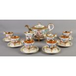 A Capodimonte six place tea set, with gilt edging and decorated with cherubs. Comprising of cups,