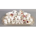 A tray of Royal Albert Old Country Roses ceramics. Includes novelty teapot, cat figure group, napkin
