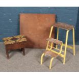 A folding table along with a small pine work box and folding steps.