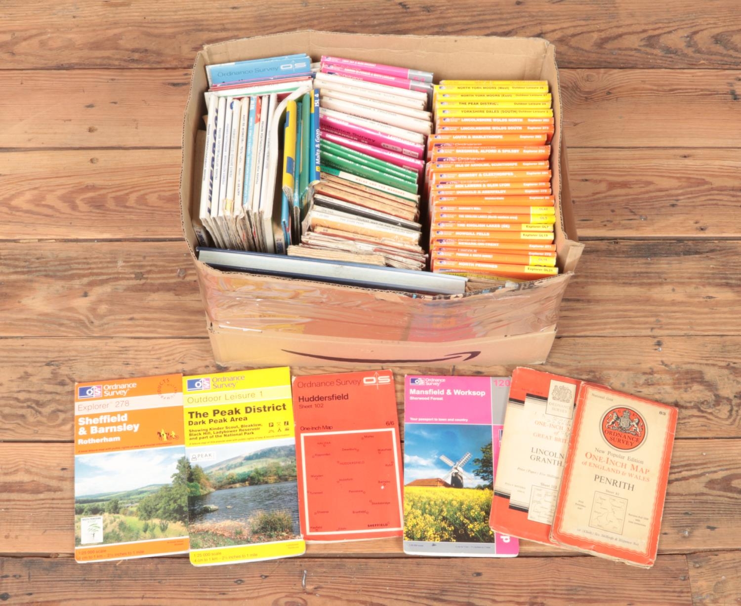 A large box containing a good collection of ordinance survey maps of various locations, include