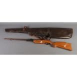 A Relum Tornado .22 under-lever air rifle with leather carry case.
