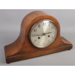 An oak cased dome shaped mantel clock. Movement stamped Haller.