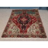 A vintage Persian Herlz village rug. Approx. dimensions 194cm x 152cm.