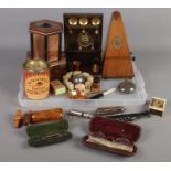 A tray of collectables. Including wooden musical cigarette dispenser, pocket knives, cased
