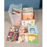 Two boxes of assorted records mainly consisting of pop and easy listening examples. To include