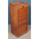 An oak tambour front filing cabinet. (102cm x 43cm)