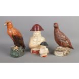 A collection of novelty decanters including Famous Grouse, Whyte and Mackay Eagle and Napoleon