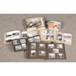 Two boxes of vintage monochrome photographs and negatives.