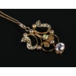 An Edwardian 9ct Gold pendant set with peridot, amethyst seed pearls, on dainty 9ct gold chain.