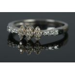 A 14ct white gold and diamond ring. Size I, 1.4g.