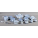 A collection of Wedgwood tableware in sky blue jasperware. To include teapot, salt and pepper