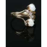 A 9ct Gold opal and white sapphire dress ring. Size TÂ½. Total weight: 4.4g