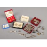 A collection of gentleman's accessories. Includes tie slides, cufflinks, white metal chains, St