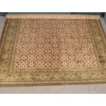 A large green ground floral wool carpet. (300cm x 256cm)
