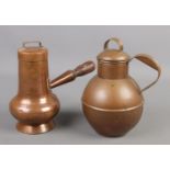 A Martins of Guernsey copper cream jug along with a similar hammered copper vessel.