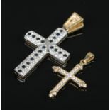 Two yellow and white metal crucifix pendants set with paste stones. Total weight: 9.1g Both examples