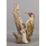 A pottery Woodpecker sculpture. Signed and dated N Dalrymple 2002, H 37cm.