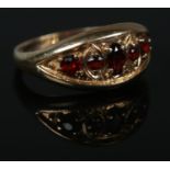 A vintage 9ct Gold garnet five stone ring. Size L. Total weight: 2.4g Good condition.