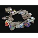 A continental silver charm bracelet with charms, most stamped 800. Charms include horseshoe,