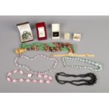 A quantity of assorted costume jewellery including beaded necklaces, ring, earrings, etc.