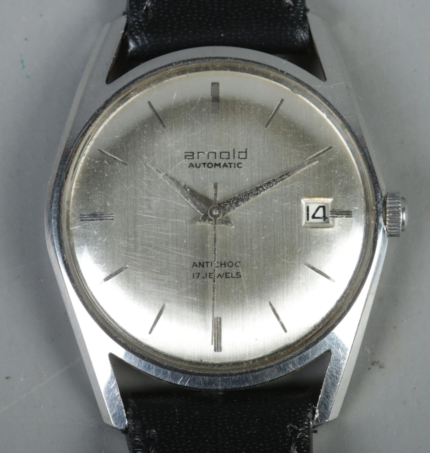 A gentleman's stainless steel Arnold automatic wristwatch.