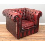 An oxblood leather Chesterfield club arm chair.