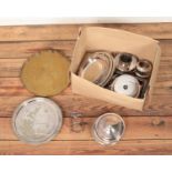 A box of metalwares including brass tray and several pieces of silver plate.