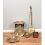 A collection of metalwares, to include Peerage brass topped table, bedwarmer, copper planter and