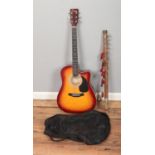 An Encore model ENC165EAR acoustic guitar with case along with a folk fiddle.