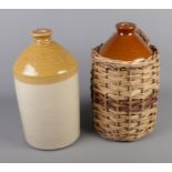 Two stoneware flagons. One in wicker carry basket, the other marked for Thomas Richards, Mansfield.