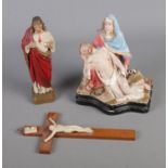 Three religious figures including crucifix and Jesus in prayer.