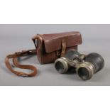 A cased pair of Le Jockey Club binoculars.