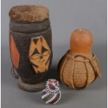 A carved African animal hide skin drum along with two gourds. Including beadwork example.