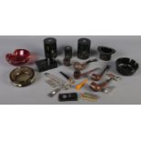 A box of smoking related items. Includes pipes, cigar cutters, ash trays, etc.