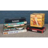 A collection of board games including Pictionary, Operation, Game of Life, Air Traffic Control, etc.