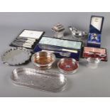 A quantity of silver plate. Includes lion mask handle tea caddy, tray, wine bottle coasters,