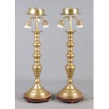A pair of large brass table lights. Height 59cm.