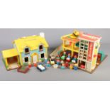 A Fisher Price family play house and parking ramp service centre. Includes cars and figures.