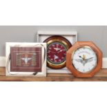 Two Parachute Regiment clocks along with a related framed display.