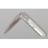 A Georgian folding fruit knife with mother of pearl scales and silver blade.