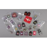 A collection of keyrings, bottle openers and coasters, mostly bearing the Parachute Regiment