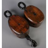 Two heavy duty double roller wood and iron pulleys. 16cm x 33cm x 14cm.