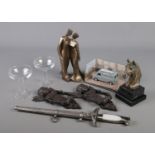 A quantity of collectables. Includes James Bond model car, reproduction Third Reich dagger,