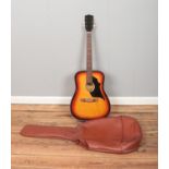 A Laredo Model 3169 acoustic guitar with case.