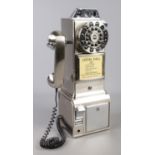 A Wild & Wolf novelty telephone modelled as a payphone.