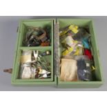 A fishing tackle box and contents of fly fishing equipment. Includes, hooks, fly-tying materials,