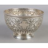 A silver pedestal bowl with repousse decoration. Assayed London 1893 by Carrington & Co. 12cm