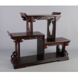 A Chinese hardwood stand. Height 55.5cm, Length 70cm.