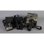 Three cameras including Fujifilm Finepix HS10, Finepix S2950 and Polariod Supercolour.